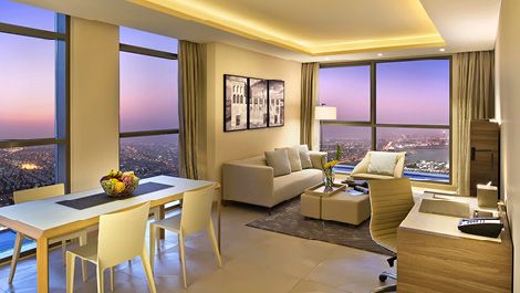 City skyline view living room at voco Doha West Bay Suites